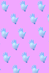 Blue latex glove as balloons pattern on hot pink background.