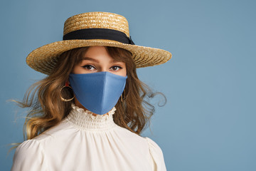 Woman wearing trendy spring, summer fashion outfit during quarantine of coronavirus outbreak. Model...