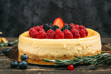 Side view on sweet dessert cheesecake with berries
