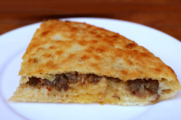 Sliced of Kubdari, Tasty Georgian Flat Bread Stuffed with Spiced Beef, Traditional Dish of Svaneti Region