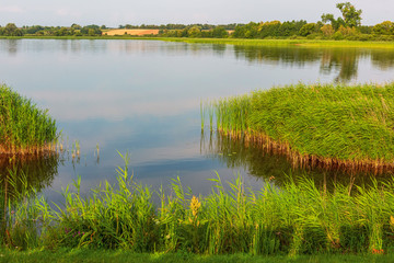 Amazing landscape of lake with crystal clear green water and Perfect blue sky. Poland, Europe