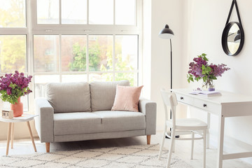 Interior of living room with spring flowers