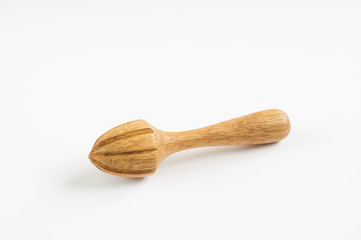 Wooden squeezer for lime, lemon and orange on white .