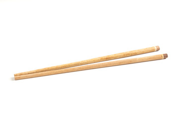 Wooden chopsticks isolated on white .