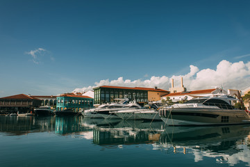 Fototapeta na wymiar sunshine on docked yachts and buildings in mediterranean sea