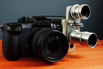 Vintage retro film camera and modern camera for shooting video.