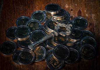 Old key on money coins.No trade mark or invalid sign on coins