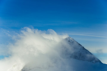 Rocky top Austrian Alps shrouded in cloud