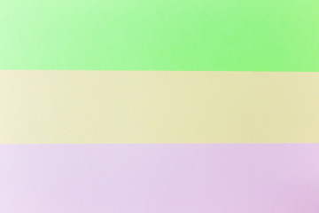 Fototapeta premium Pastel papers color background is nested backdrop flat lay. green, pink, orange