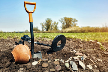 Search for treasure using a metal detector and shovel.