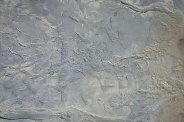 Aerial view of surrealistic industrial place. Dry surface. Desertic landscape. Human impact on the environment. View from above. Abstract industrial background. Photo made by drone.