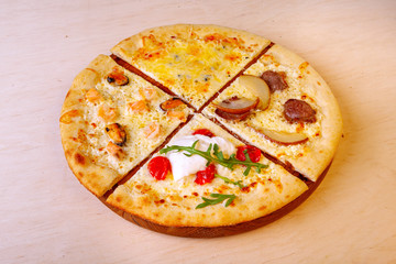 fresh pizza with ingredients in it on a wooden board
