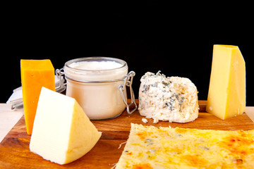 fresh pizza with ingredients in it on a wooden board