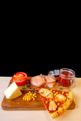 fresh pizza with ingredients in it on a wooden board