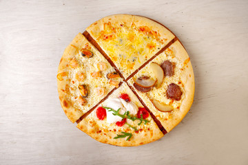 fresh pizza with ingredients in it on a wooden board