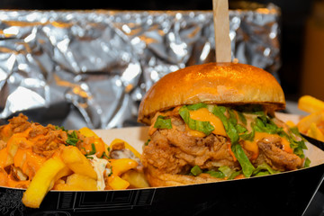 Fresh melting burger ready to eat during fast food festival.
