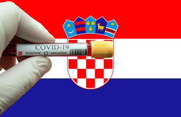 Positive COVID-19 blood test sample tube with Flag of Croatia 