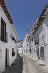 Beautiful view of Mijas Picturesque Narrow Street. Mijas - Spanish hill town overlooking the Costa del Sol, not far from Malaga. Mijas known for its whitewashed buildings. Mijas, Andalusia, Spain.