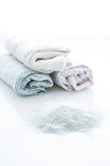 Laundry - Washing powder with clothes isolated on white background