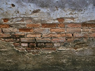 Peeling off concrete and brick wall