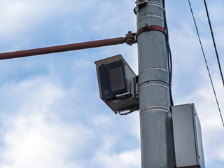 Smart transportation system 'Autodoria' mounted on the mast of the road post.  System has registrar with camera, computational module, GLONASS receiver, digital signature, IR illuminator & 3G modem