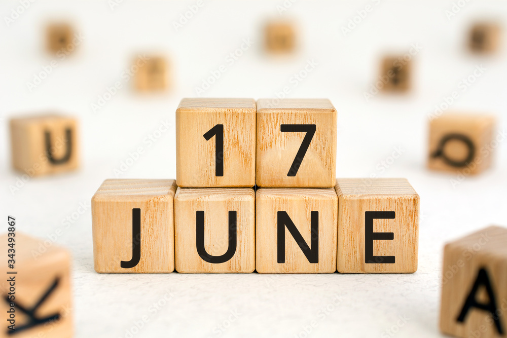 Poster june 17 - from wooden blocks with letters, important date concept, white background random letters a