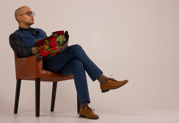 man in a chair with flowers