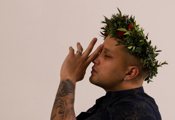 man with flowers on his head