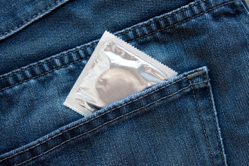 Condom in pocket. Close up. Lifestyle concept.