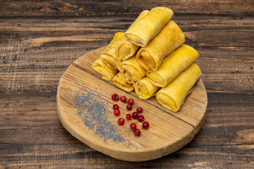 Frozen pancakes on a wooden background