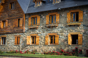 Stone and wood house in the civic center of Bariloche, Argentina. A sunny day in March 2020