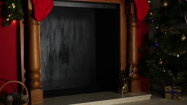 Santa's Sack dropping down the chimney on Christmas Eve, full of presents and gifts - Stock Video Footage