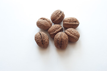 Delicious whole walnuts, on white background