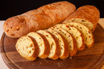 sliced sliced fresh bread on a wooden board