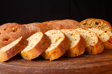 sliced sliced fresh bread on a wooden board