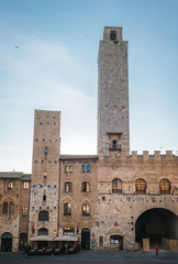 Fototapeta na wymiar View of the famous towers from the historic center of the village of San Gimignano, a heritage of humanity, on a summer morning