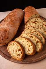 sliced sliced fresh bread on a wooden board