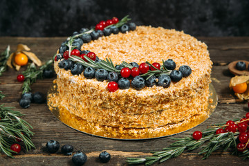 Gourmet sweet appetizing honey cake with berries