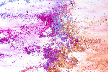 Blue Purple and Pink crushed eye shadow isolated on white background.Splatter make up and cosmetic products.