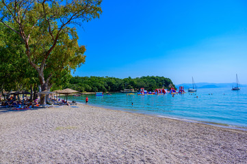 Dassia Beach with crystal clear azure water in beautiful landscape scnery - paradise coastline of...