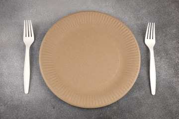 A set of eco-friendly utensils on a concrete background. The concept of eco-friendly utensils. Flatlay. From above.