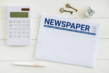 Top view of blank empty piece of white newspaper mockup on a table