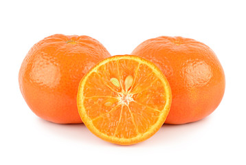 Two tangerine and half isolated on white