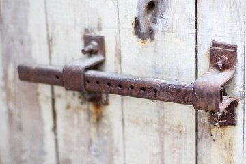 Vintage lock on an old door, corrosion and rust of metal