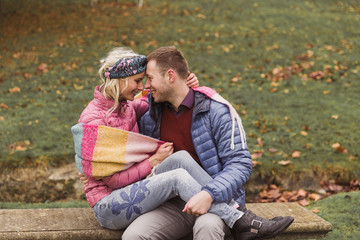 couple sitting on the bench full of love