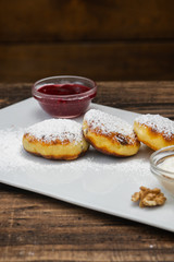 Cheesecakes on plate on wooden background