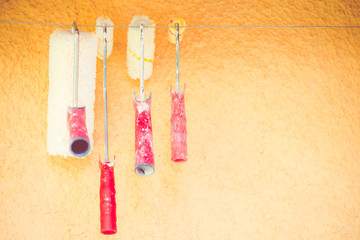 painter rolls hanging to dry Homework concept