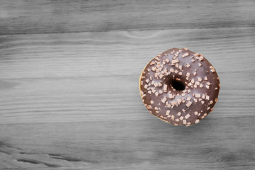 Handmade chocolate donut, on a wooden surface. The view from the top