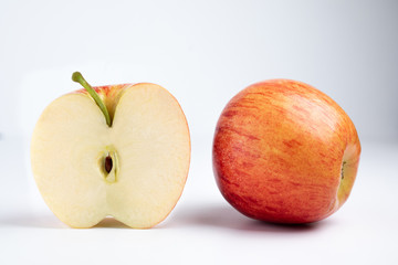 Isolated apples. Whole red apple and a half isolated on white background with clipping path