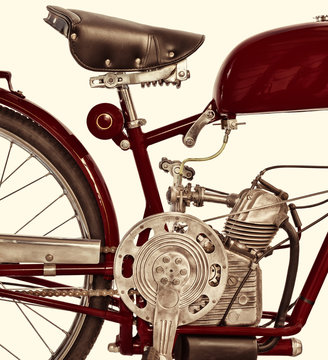 Retro styled image of an ancient Italian red motorcycle
